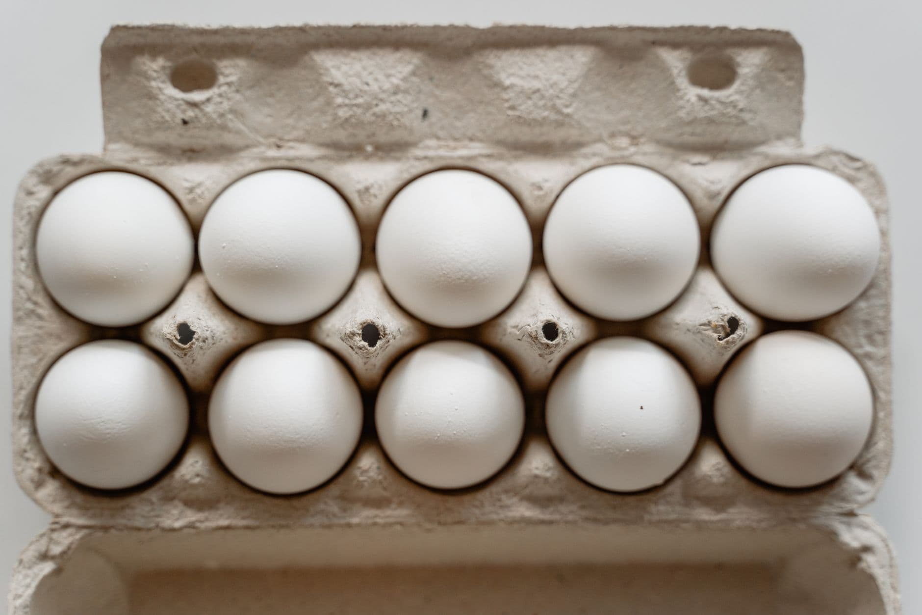 Eggs portioned into carton compartments