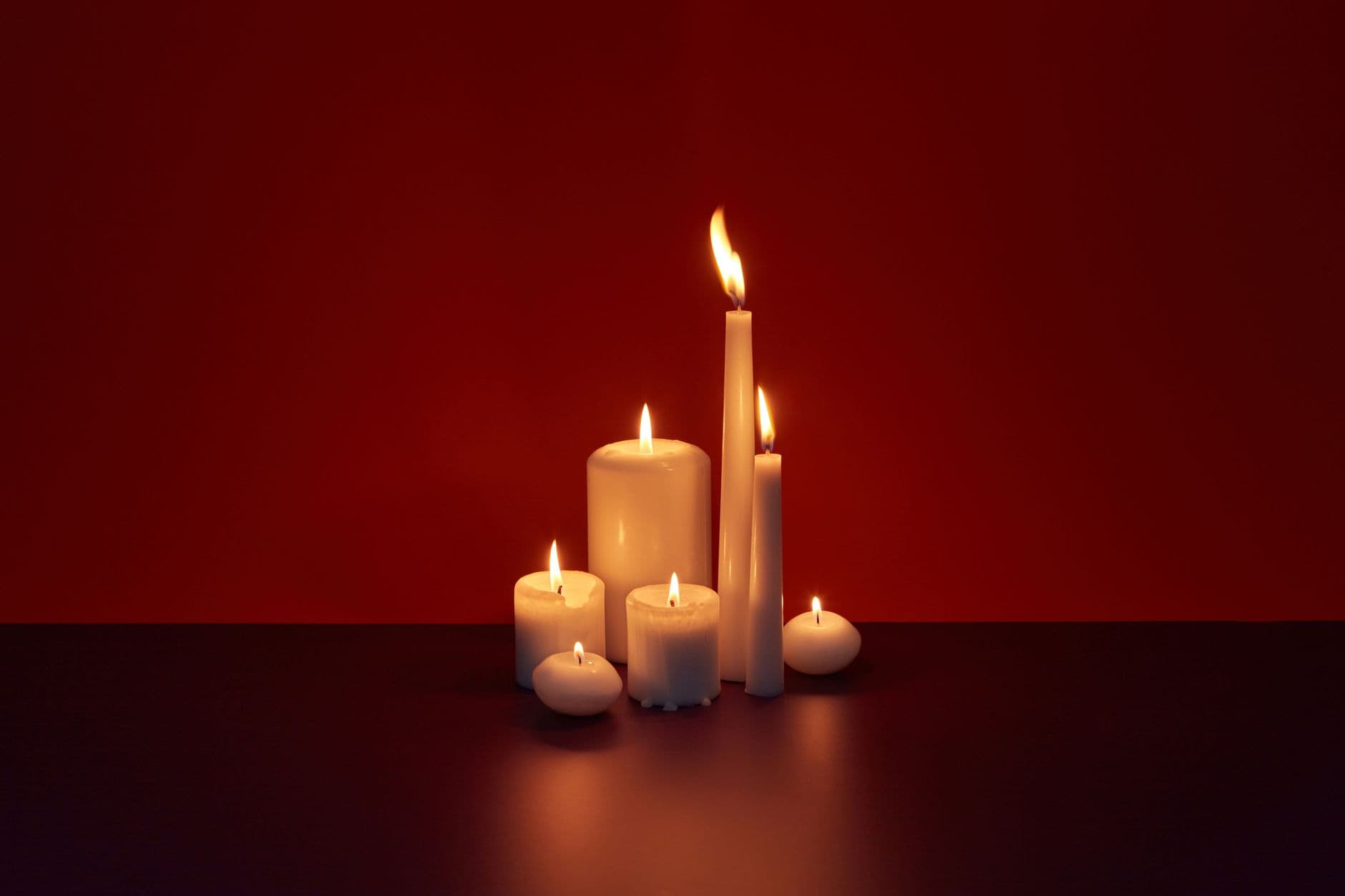 White candles of different heights