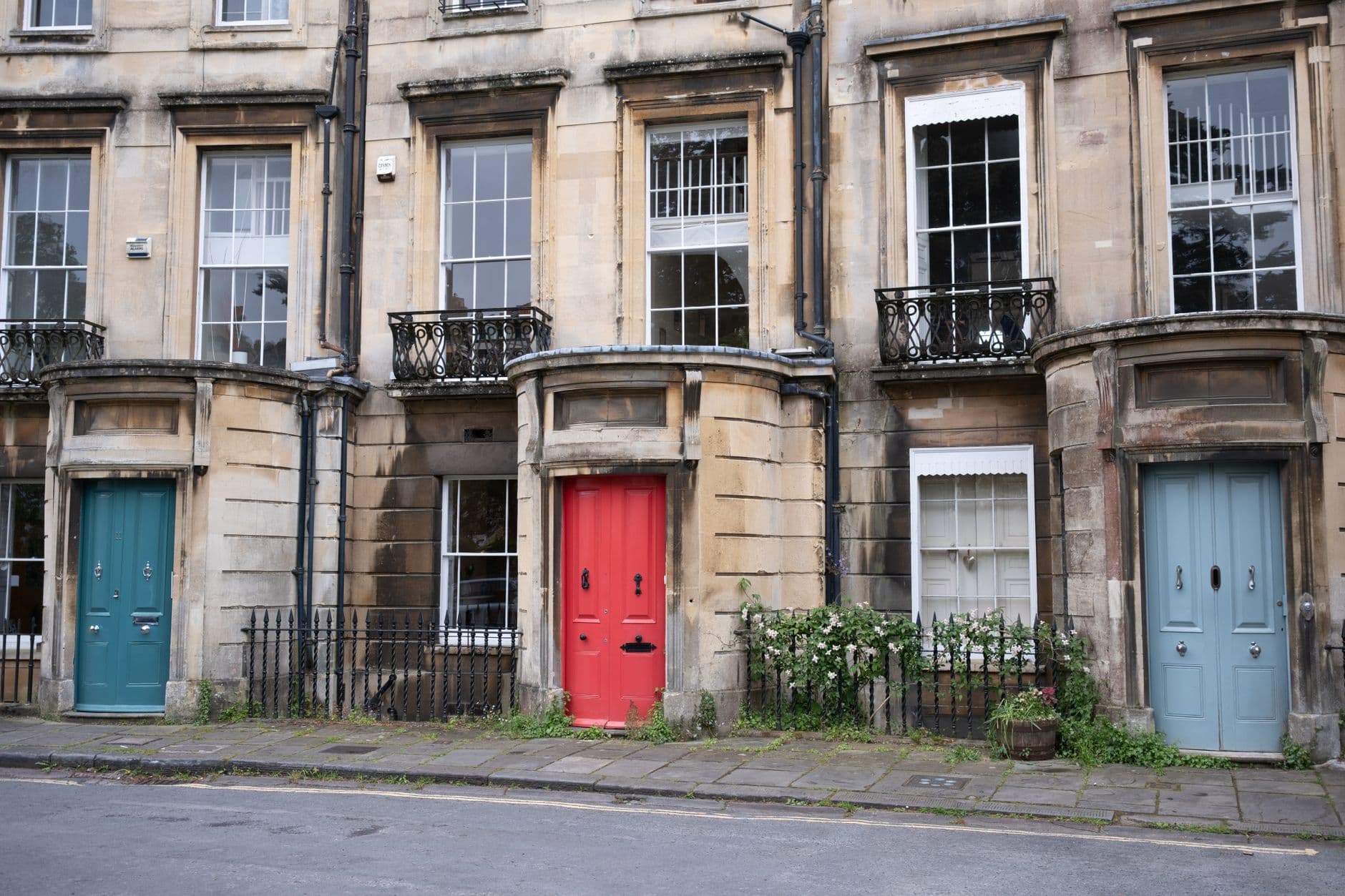 A row of front doors, each a different colour