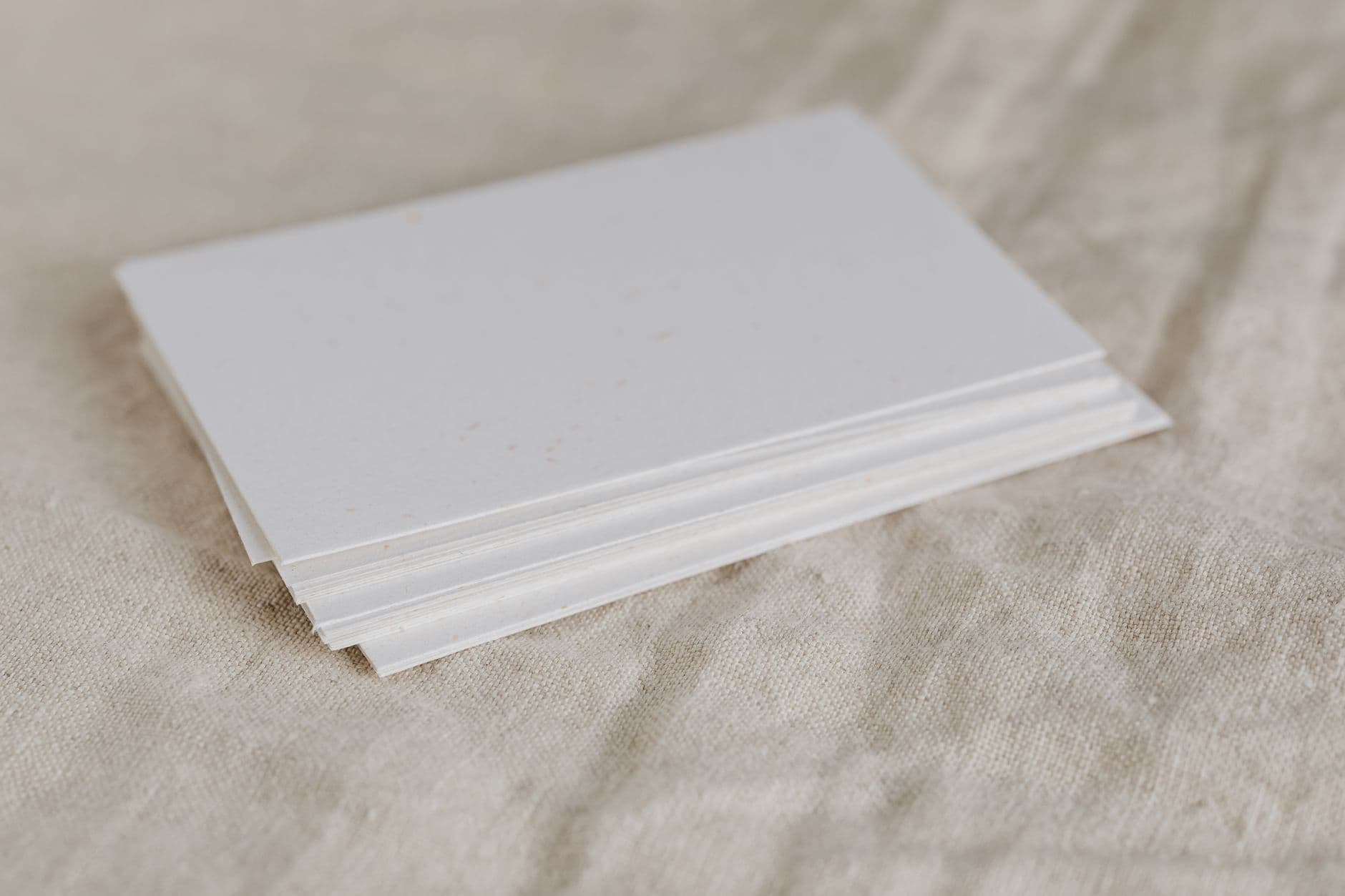 A stack of blank card on linen