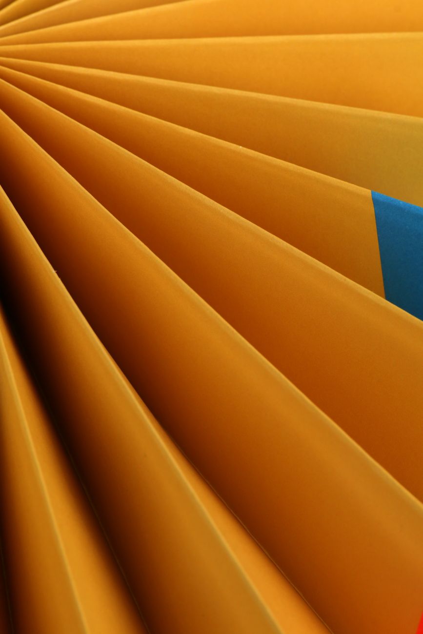 Fanned orange folder dividers in close-up