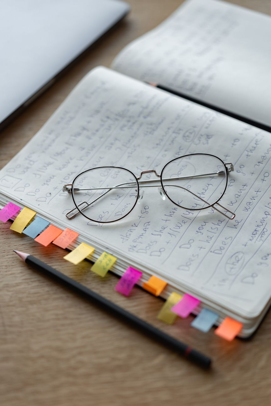 Marker tabs flagging pages in a notebook