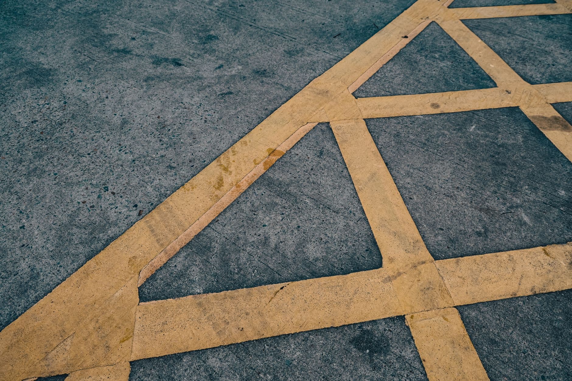 Yellow painted boundary lines on a concrete floor