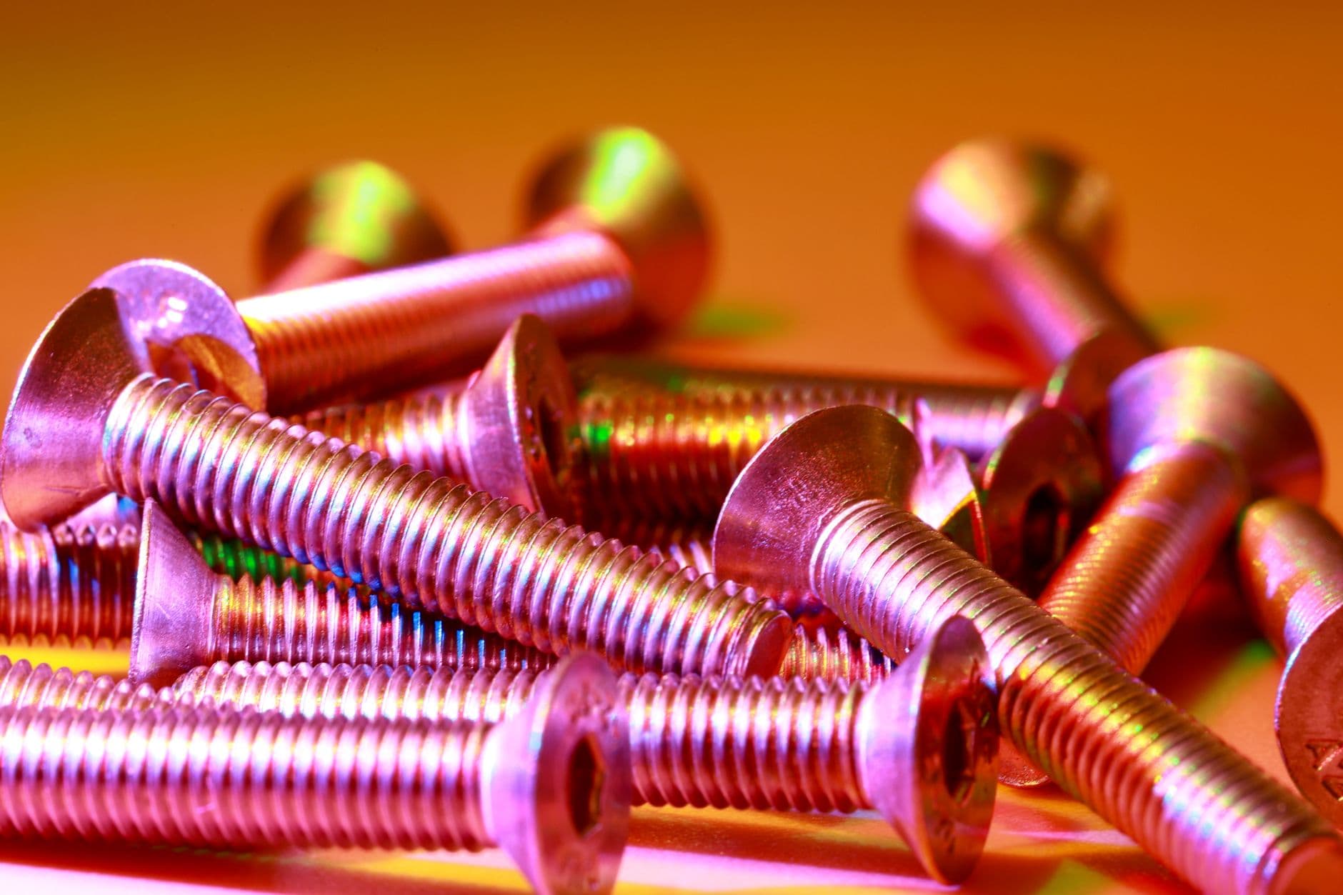 A pile of brass screws