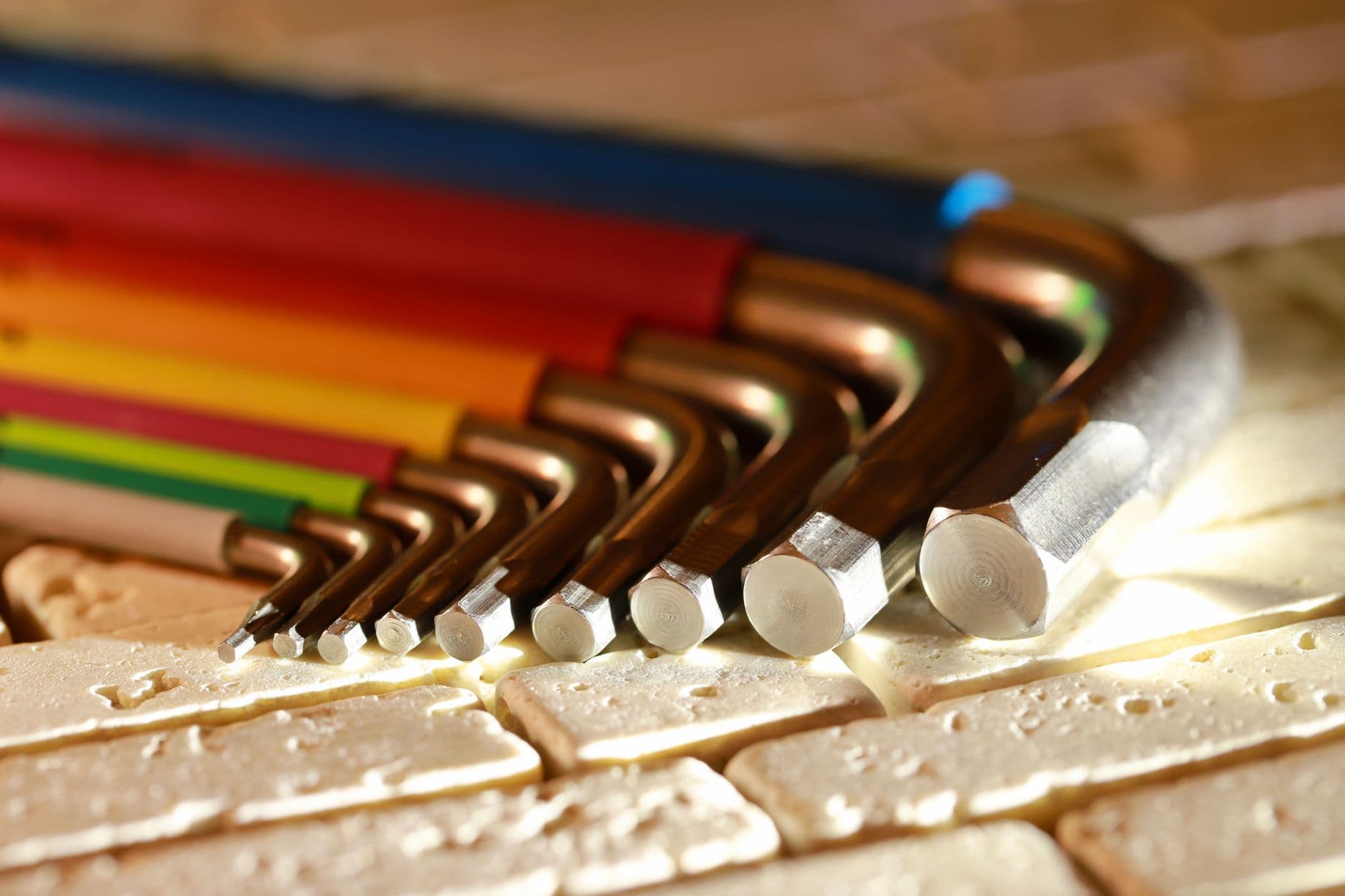 A fan of hex keys with coloured handles