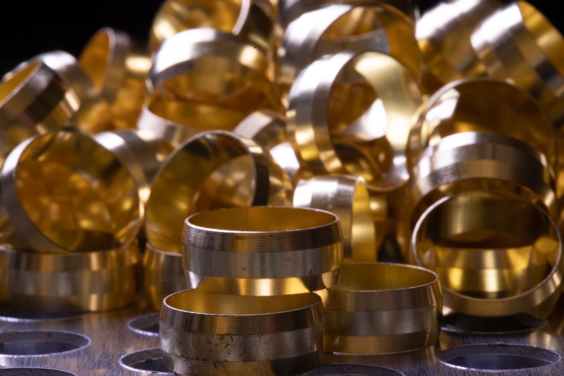 A pile of brass compression fittings
