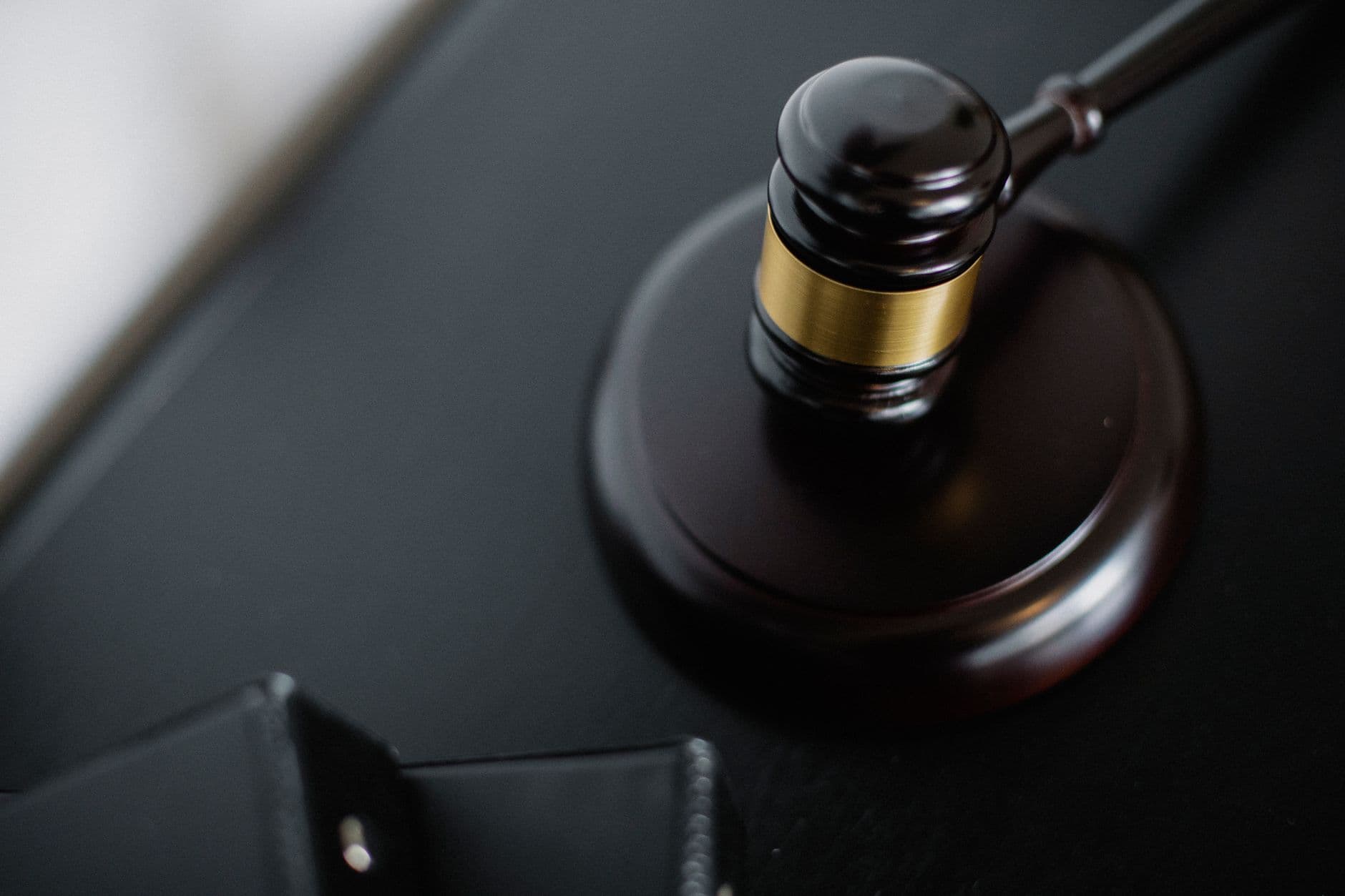 A gavel resting on a desk
