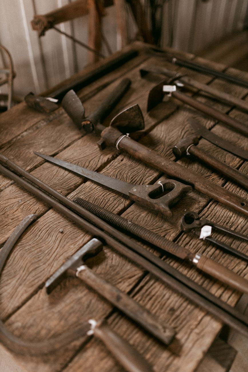 Old hand tools on a wooden bench