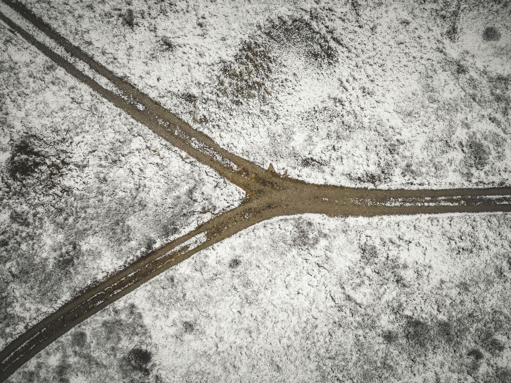 A path splitting in two across fresh snow