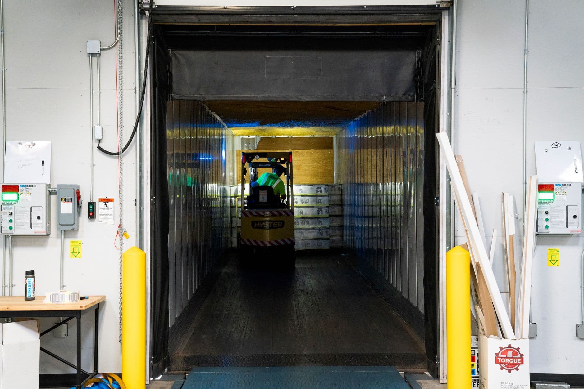 A long warehouse aisle receding into the distance, showing the walking a picker route has to cover